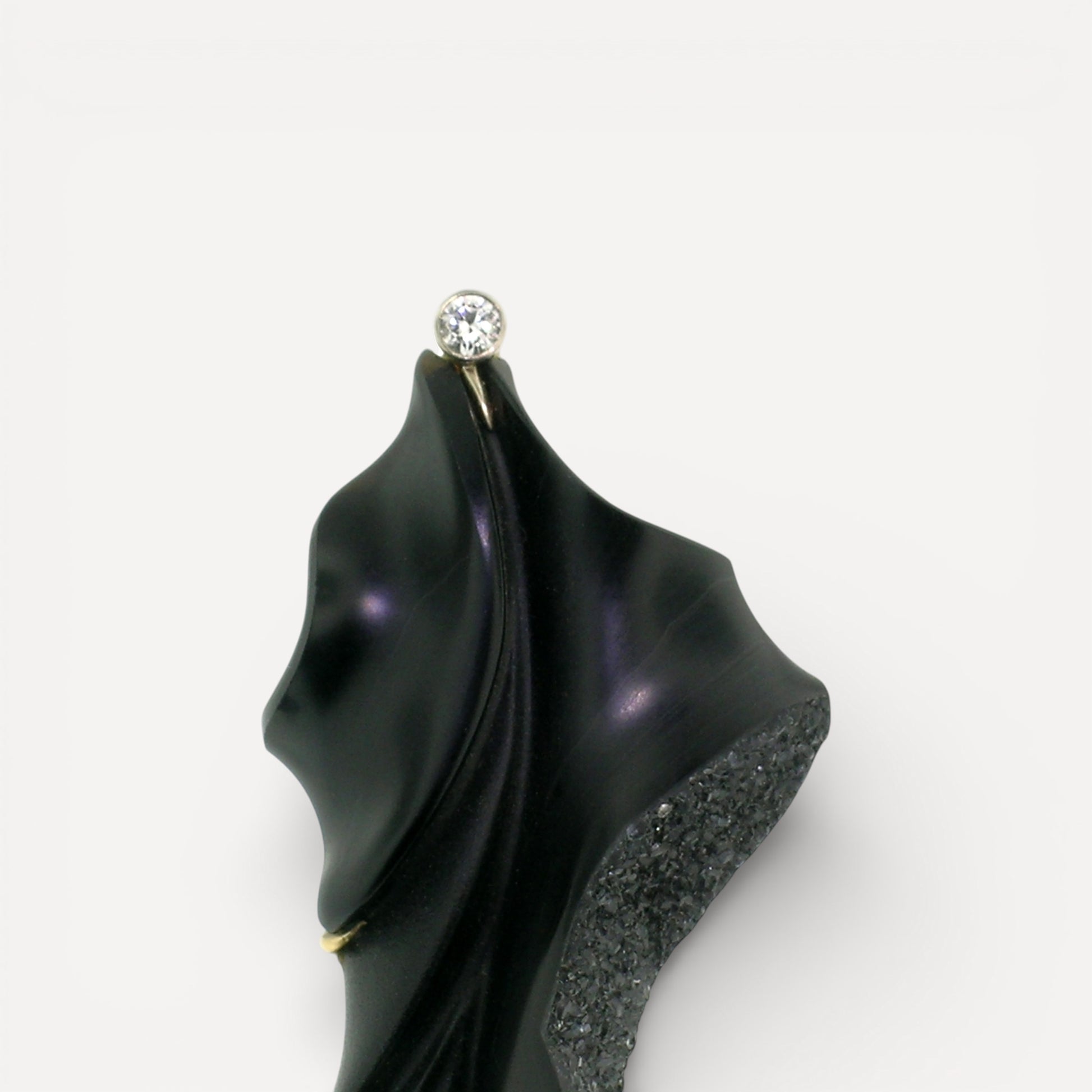 A black chalcedony carving by Steve Walters in an 18kt brooch and pendant with a diamond and Australian opal, made by ART Guyon for Cynthia Scott Jewelry.