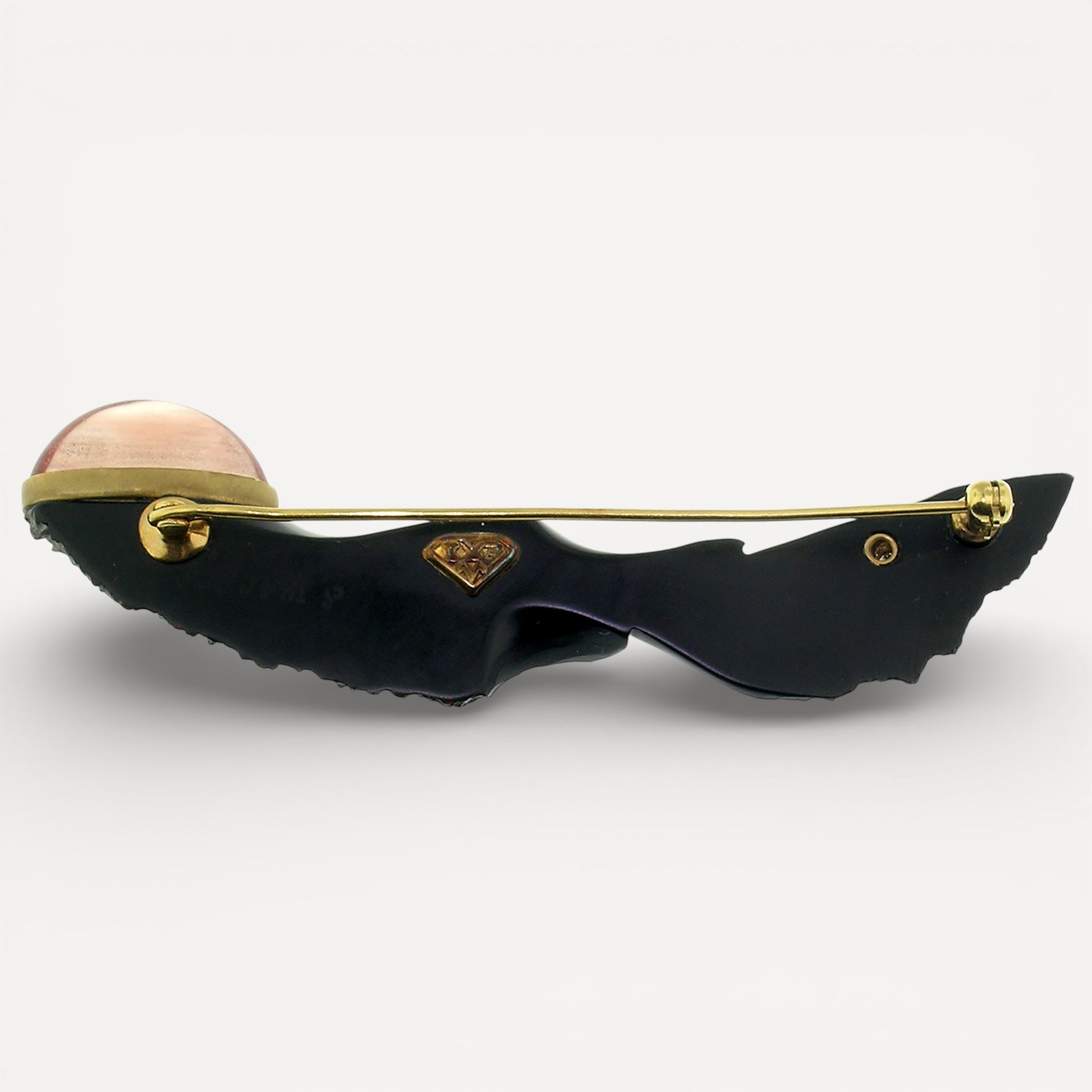 Steve Walters chalcedony carving with an Oregon Sunstone and pink diamond for Cynthia Scott Jewelry