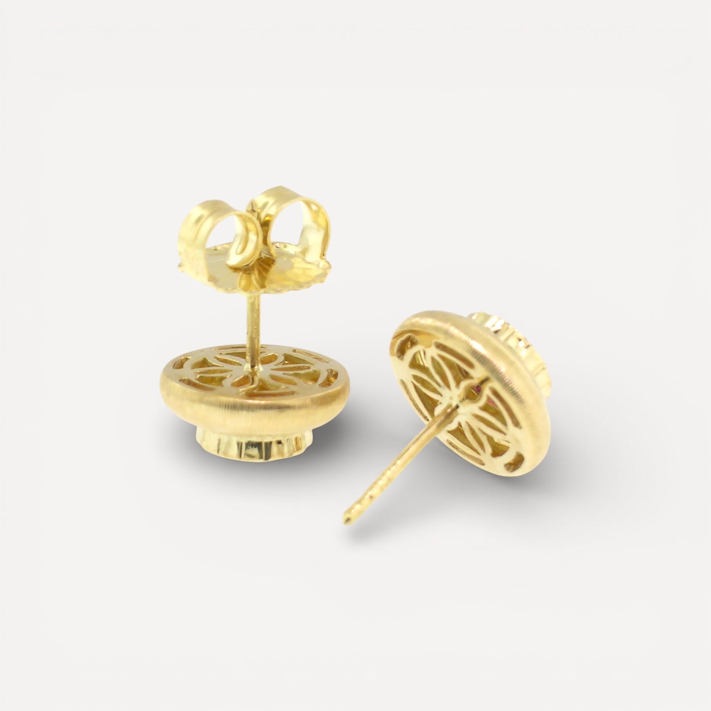 A pair of 18kt yellow gold earrings, Florentine engraved, featuring a pair of Rhodolite Garnets. Made in Florence, Italy for Cynthia Scott Jewelry.