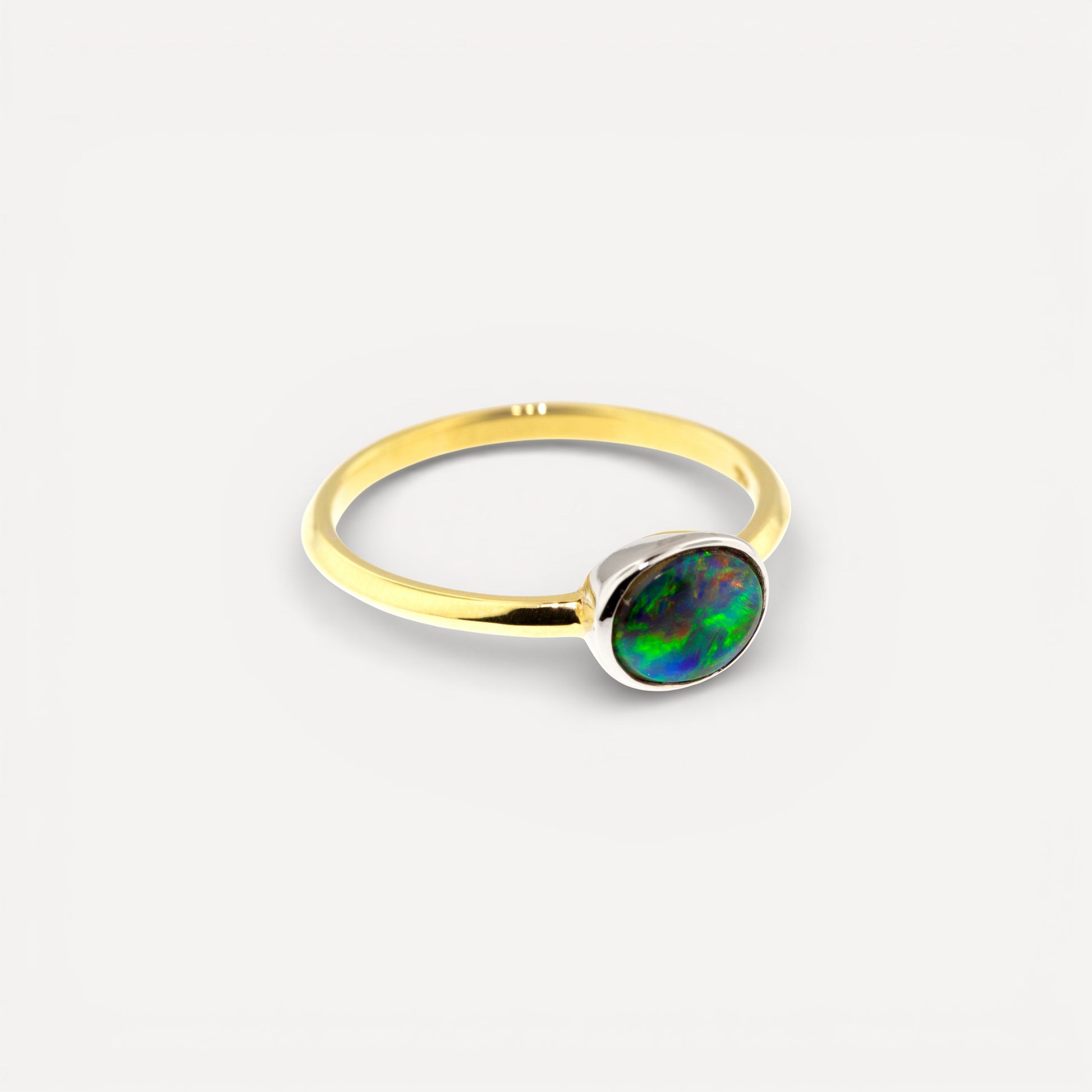 Lightening Ridge Black Opal from Australia in 18kt and Platinum Paloma Ring made in USA by Cynthia Scott Jewelry.