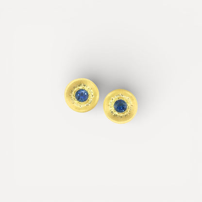 A Florentine engraved pair of 18kt gold earrings with a blue Montana sapphire center. Made in Florence, Italy by Cynthia Scott Jewelry.