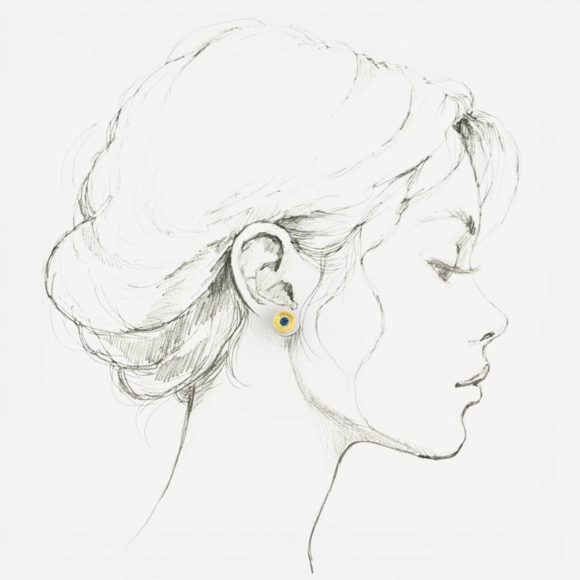 A Florentine engraved pair of 18kt gold earrings with a blue Montana sapphire center. Made in Florence, Italy by Cynthia Scott Jewelry.