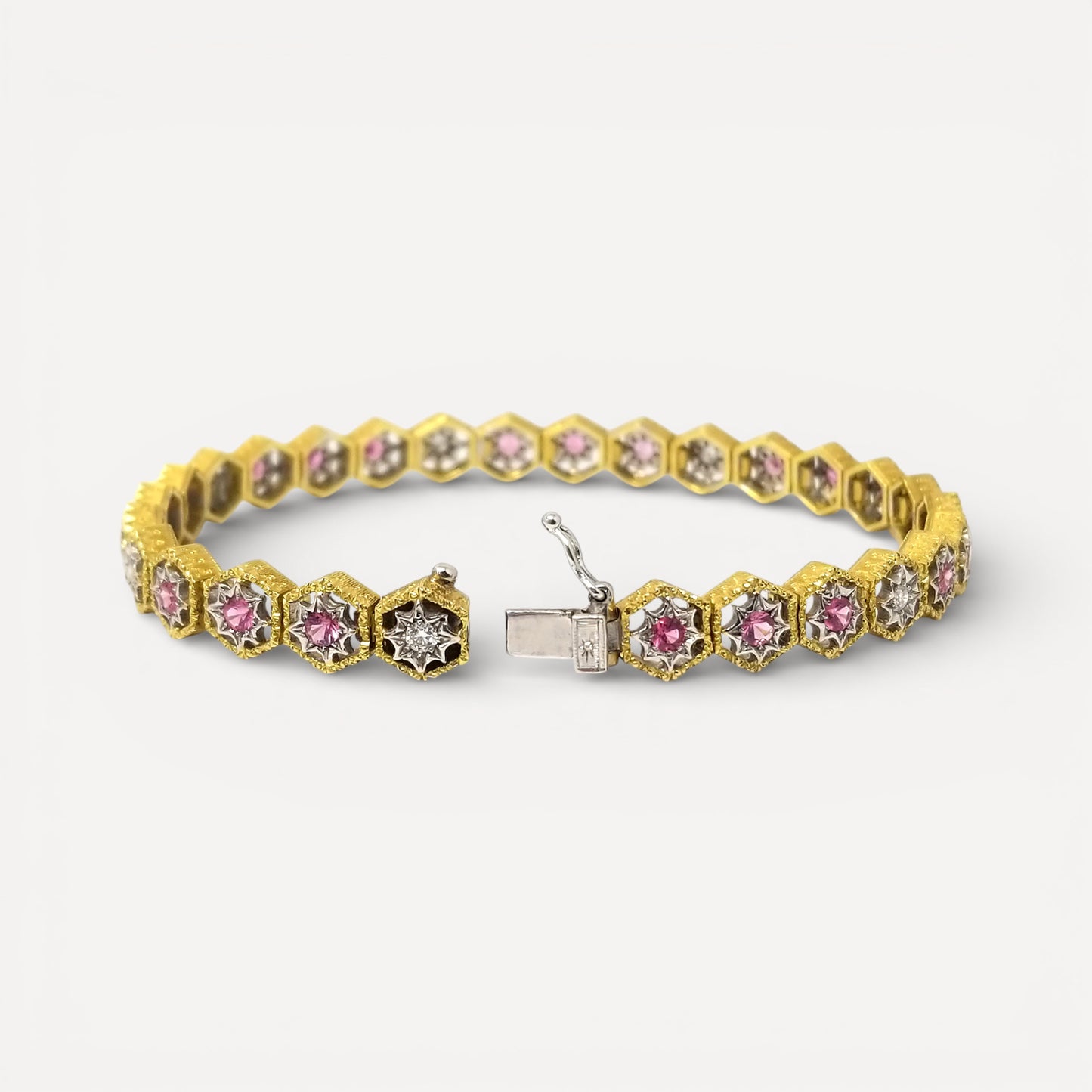 An 18kt Florentine Engraved bracelet with Mahenge pink spinels and diamonds. Made in Florence, Italy by Cynthia Scott Jewelry.