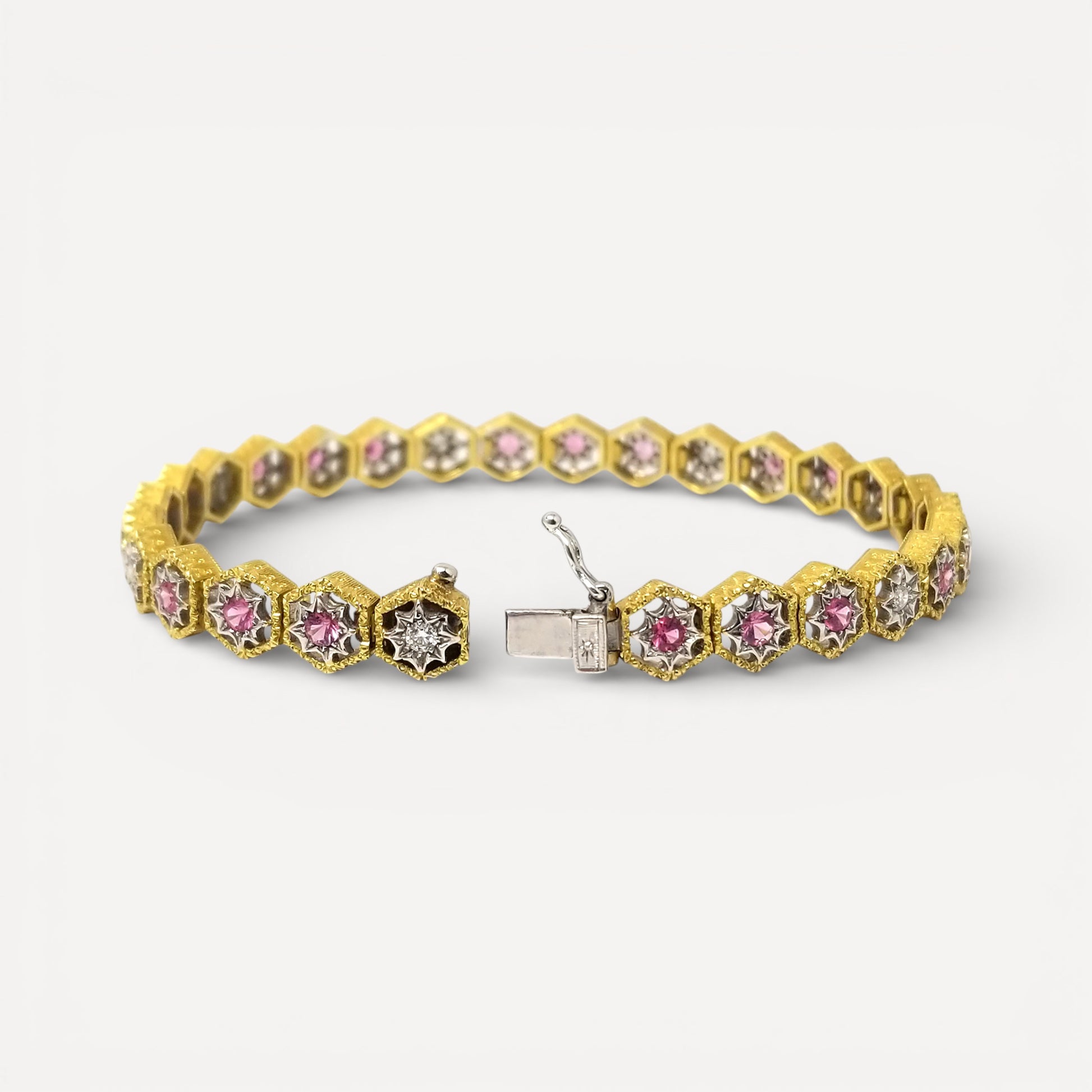 An 18kt Florentine Engraved bracelet with Mahenge pink spinels and diamonds. Made in Florence, Italy by Cynthia Scott Jewelry.