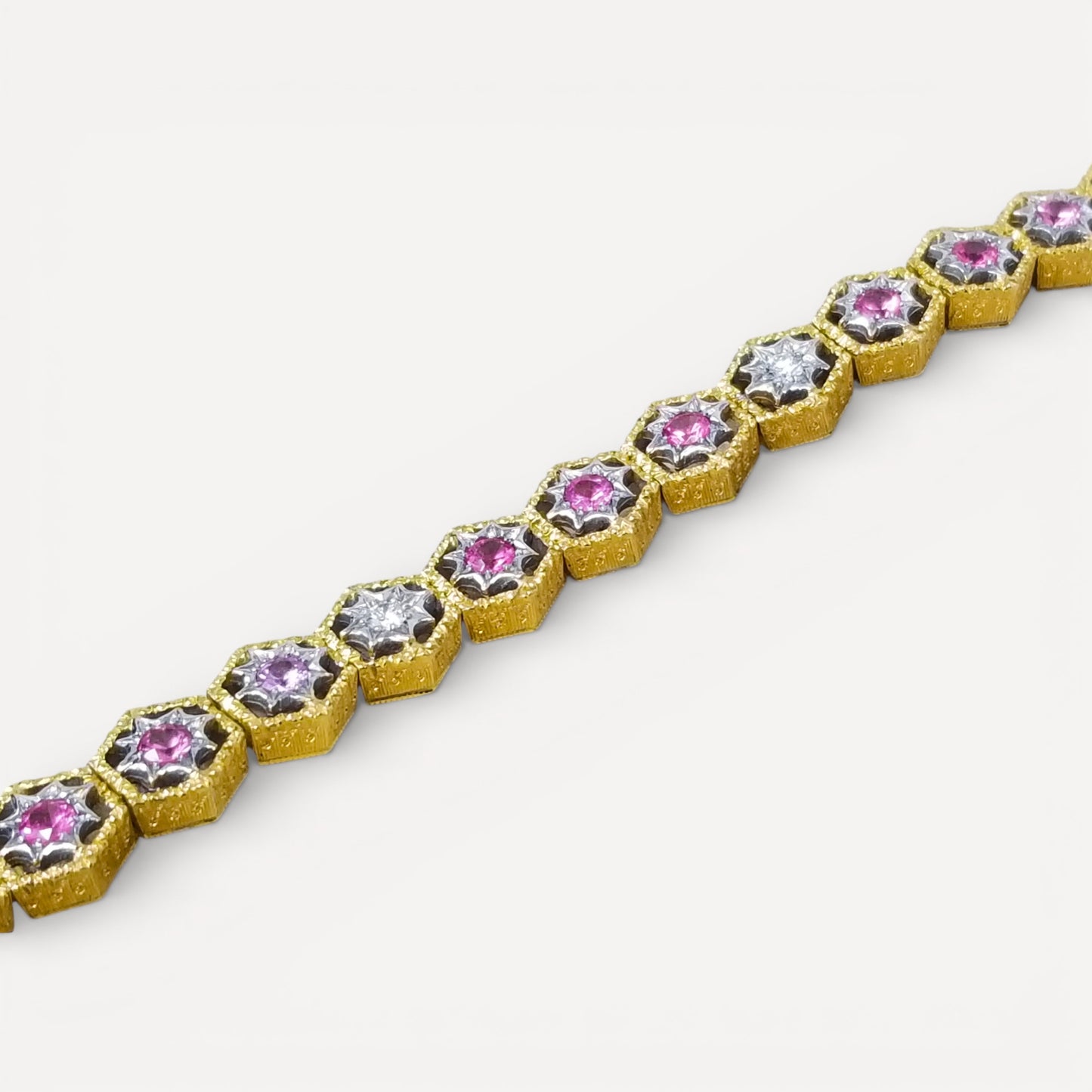 An 18kt Florentine Engraved bracelet with Mahenge pink spinels and diamonds. Made in Florence, Italy by Cynthia Scott Jewelry.