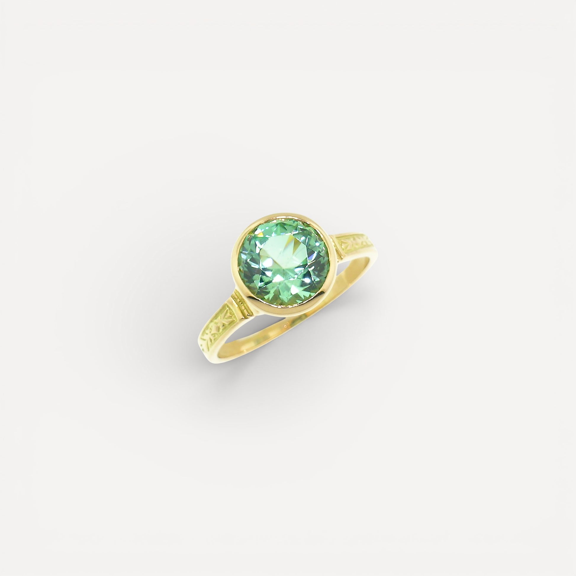 A mint green tourmaline in an 18kt Cassandra ring made in the USA by Cynthia Scott Jewelry