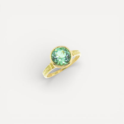A mint green tourmaline in an 18kt Cassandra ring made in the USA by Cynthia Scott Jewelry