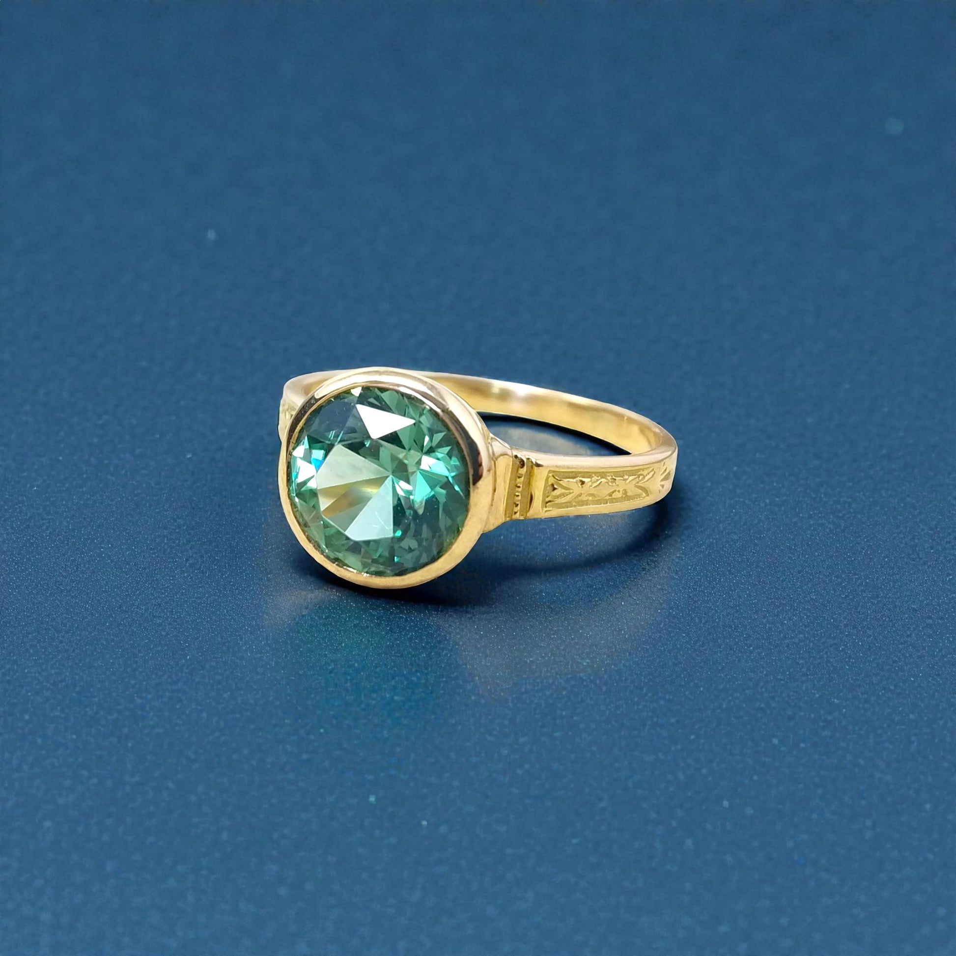 A mint green tourmaline in an 18kt Cassandra ring made in the USA by Cynthia Scott Jewelry