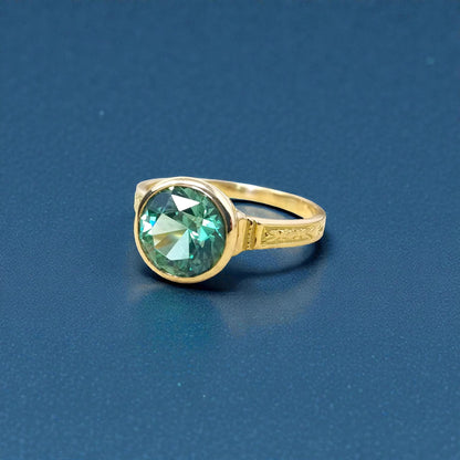 A mint green tourmaline in an 18kt Cassandra ring made in the USA by Cynthia Scott Jewelry