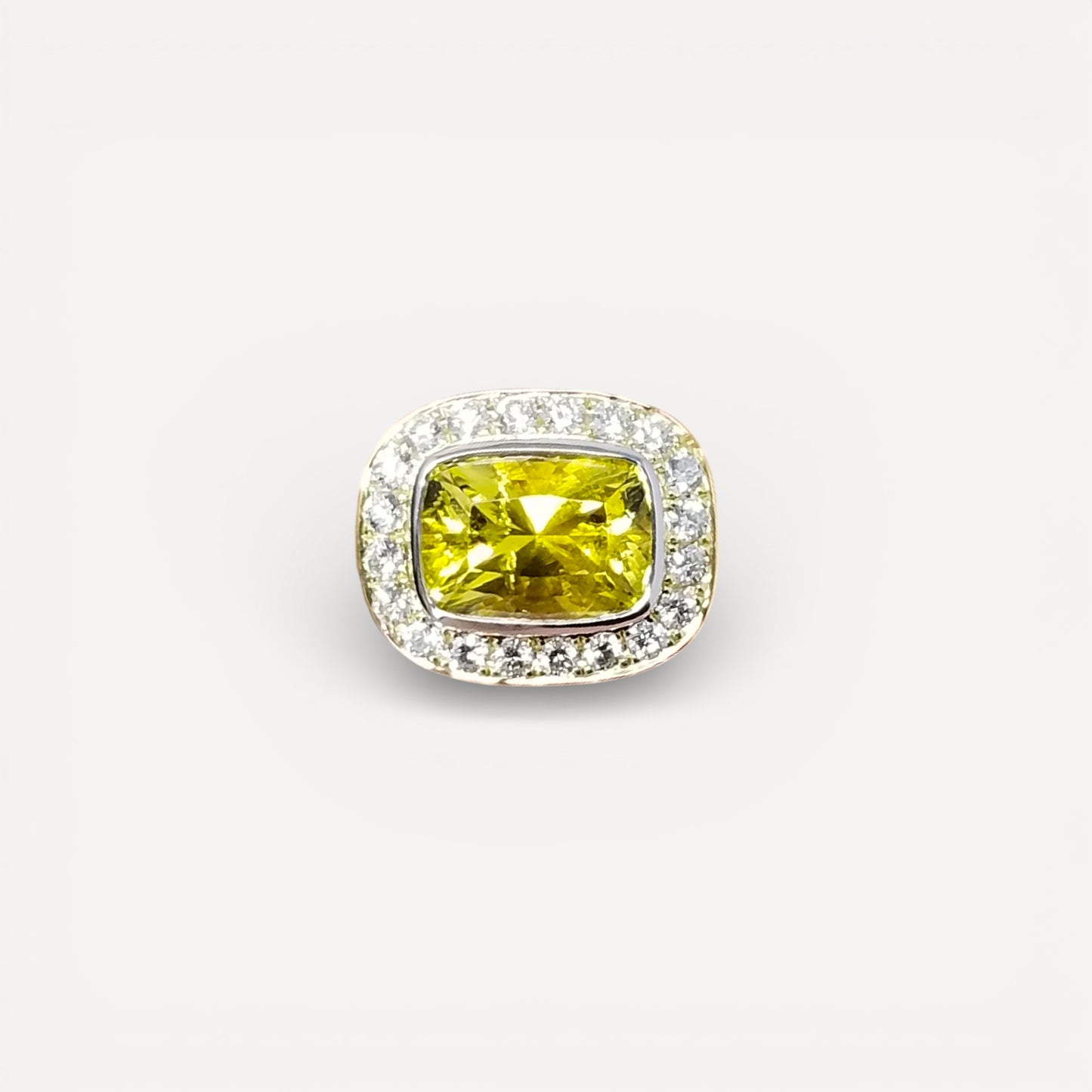 A canary tourmaline in an 18kt and Diamond Aphrodite Ring made in USA by Cynthia Scott Jewelry.