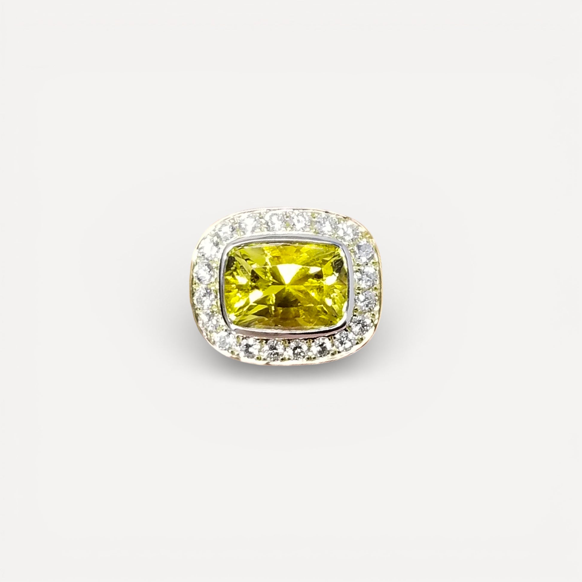 A canary tourmaline in an 18kt and Diamond Aphrodite Ring made in USA by Cynthia Scott Jewelry.