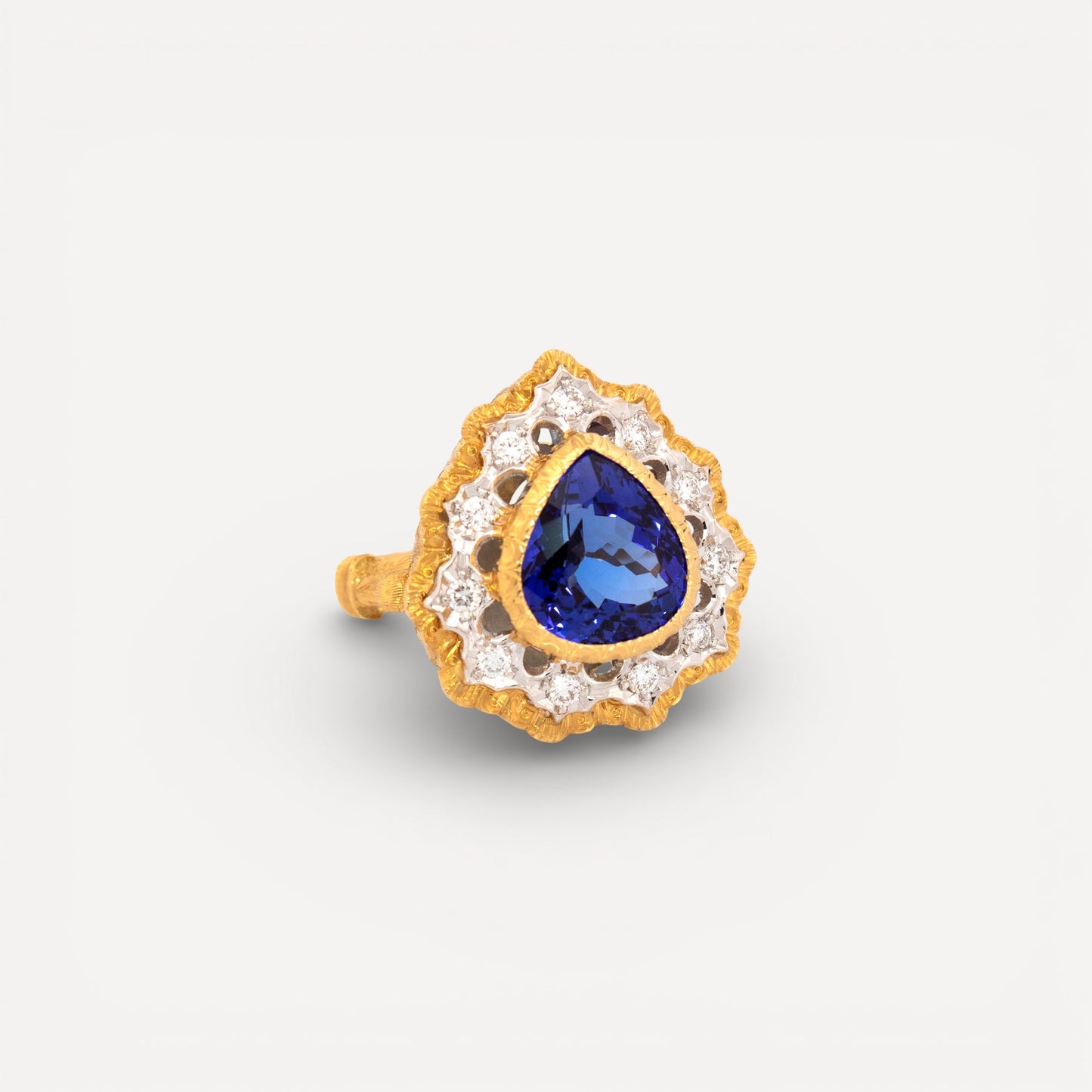 A pear shaped tanzanite in an 18kt and diamond Giulia ring made in Italy by Cynthia Scott Jewelry