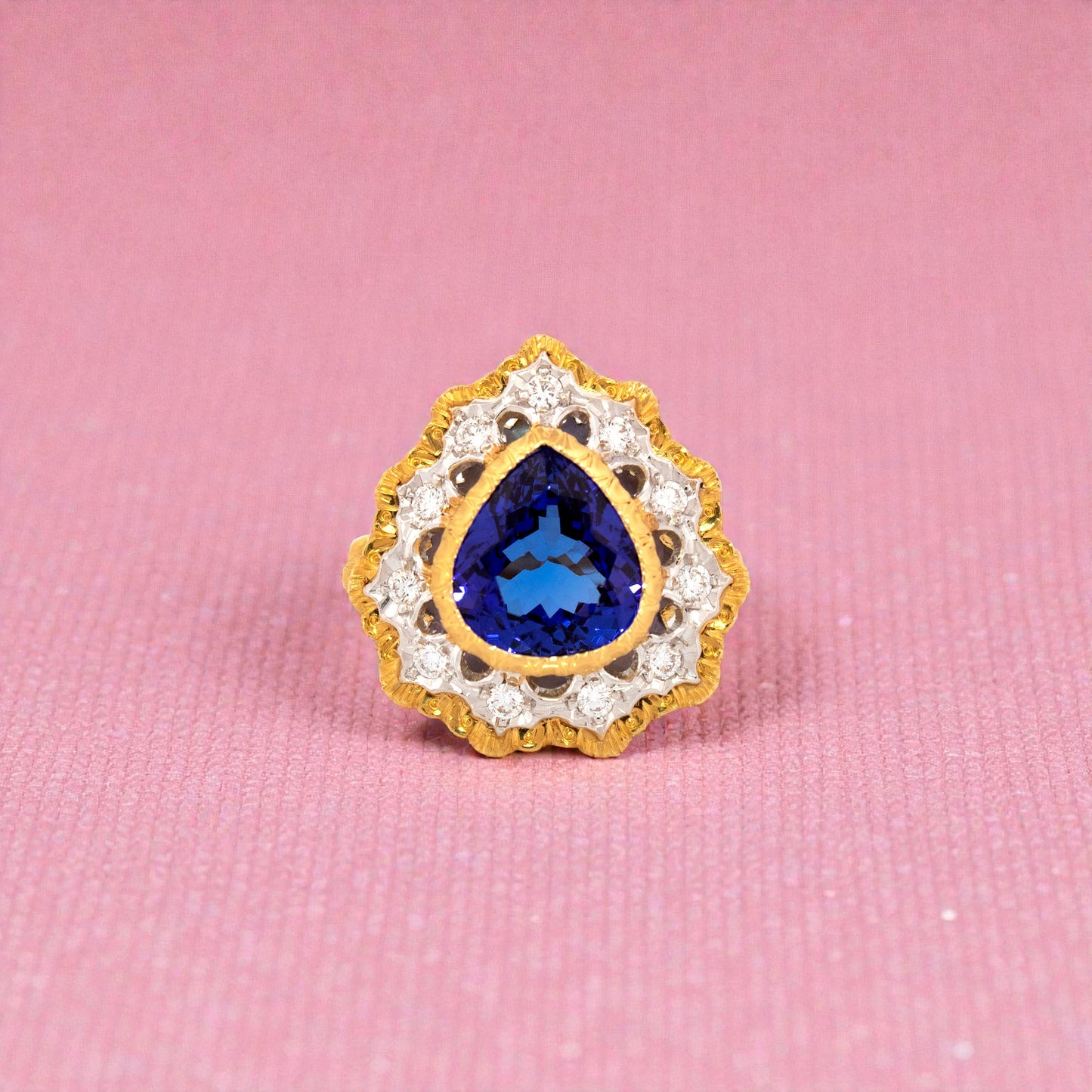 A pear shaped tanzanite in an 18kt and diamond Giulia ring made in Italy by Cynthia Scott Jewelry