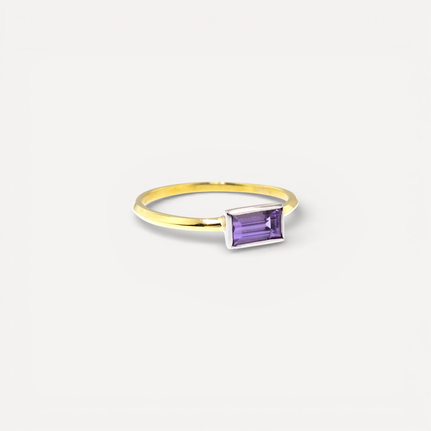 An unheated fancy tanzanite in an 18kt and platinum Paloma ring made in the USA by Cynthia Scott Jewelry