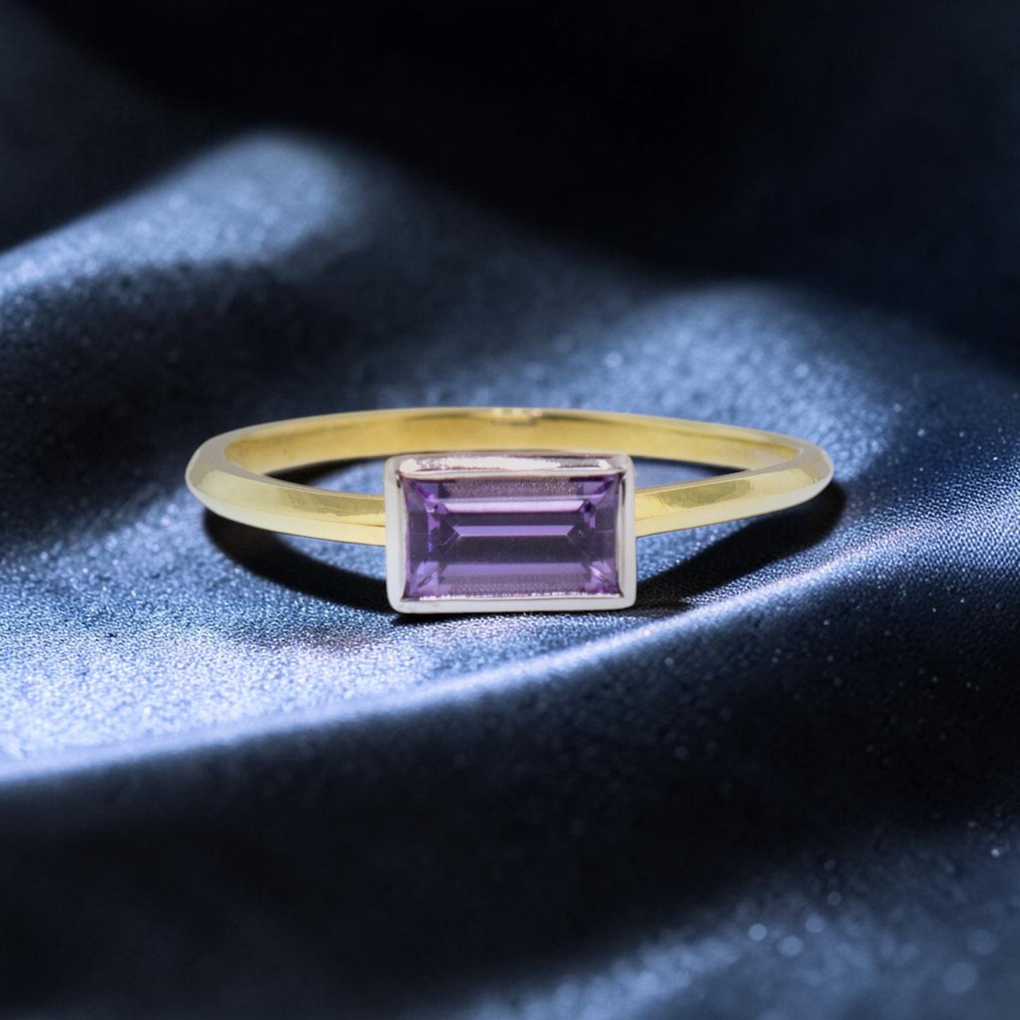 An unheated fancy tanzanite in an 18kt and platinum Paloma ring made in the USA by Cynthia Scott Jewelry